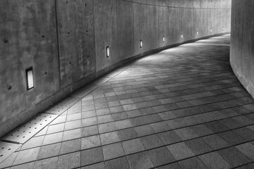 Empty pedestrian walkway in the dark
