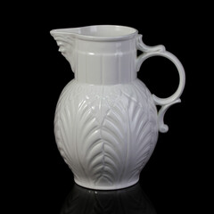 antique white porcelain vase in on a black isolated background. antique ceramic vase with stucco