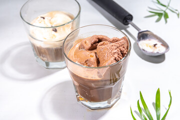Summer cold cocktail. Amaro floats with chocolate and vanilla ice cream. Affogato Coffee latte with ice cream drink. Copy space on a white table