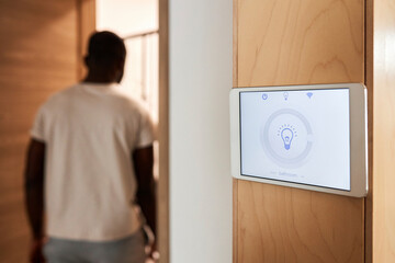 Smart home lighting system on tablet PC mounted on wall
