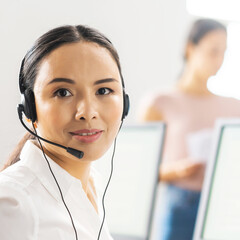 Team of professional support staff working in the office. Colleagues in the workplace solve...