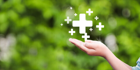 hand holding plus icon. Plus sign virtual means to offer positive thing (like benefits, personal...