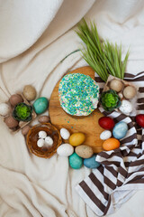 Traditional Easter cake and painted eggs on white background. Space for text