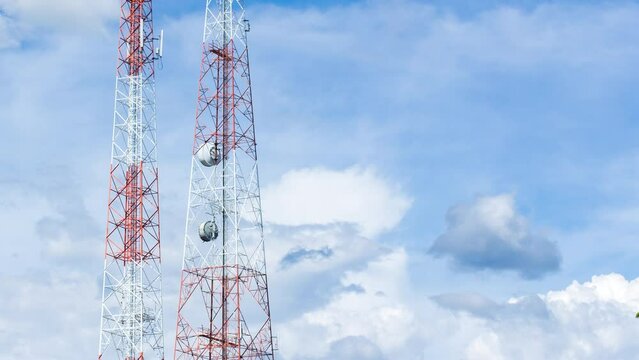 Time lapse of telecom pole with clouds moving