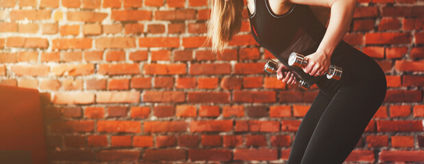 woman doing a workout with dumbbells