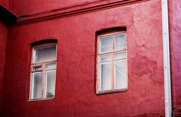 Fototapeta na wymiar Exterior facade of red historical house