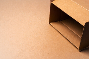 Cardboard box on beige background in studio