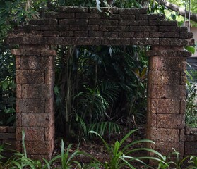 Old style brick gateway in the jungle