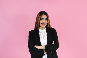 young hispanic business woman portrait smiling to camera on pink background in Mexico Latin...