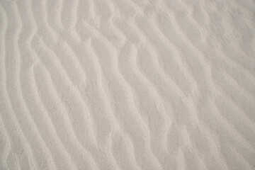 Fototapeta na wymiar sand texture. wavy sand textured background. sand textured beach.