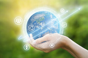 Hand hold blue planet earth with ecology icon and pointing up arrow or graph metaphor clean energy,...