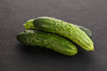 Fersh juicy green cucumbers heap