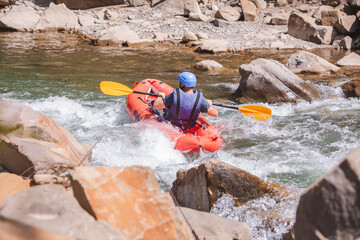 inflatable raft extreme sport at mountain river