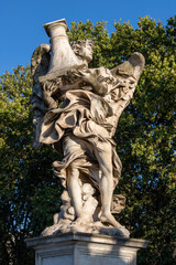 ROME, ITALY - SEPTEMBER 1, 2021: The Angel with the column on the Ponte Sant'Angelo by Antonio...
