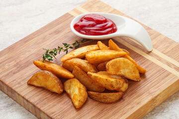 Fried rustic potato with tomato ketcup