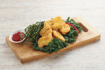 Crispy chicken nuggets with tomato ketchup
