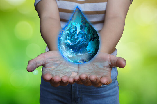 Earth fuel drop was holding in human hands. World environment day and green earth. Energy saving environment nature conservation concept