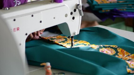 The process of creating from linen fabric in an electric sewing machine and sews the stitch along the edge into the bending with an open cut Hand made linen, towel, tablecloth, clothes, interior item