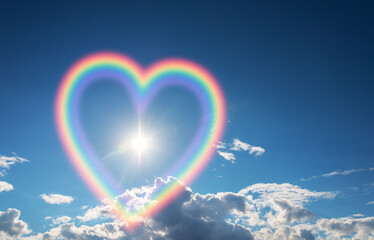 Heart shape rainbow in the sky. - 493928036