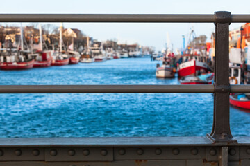 Waterway to Baltic Sea / View from steel girder bridge to small town harbor (copy space) - 493928828