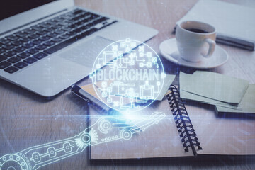 Double exposure of crypto technology drawing and desktop with coffee and items on table background....