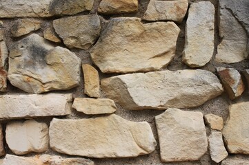 a sand-lime brick wall made of bricks with irregular surface
