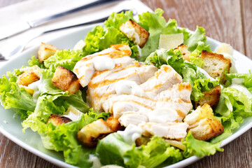 Classic Chicken Caesar Salad on a plate.