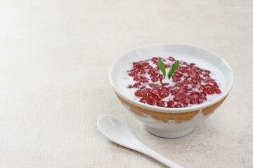 Bubur Mutiara, Bubur Sagu Mutiara, Indonesian Dessert Porridge. Made from pearl sago (sagu mutiara), sugar, pandan leaves, and coconut milk. Very famous during Ramadhan. Selective focus image.

