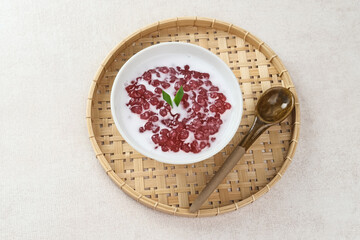 Bubur Mutiara, Bubur Sagu Mutiara, Indonesian Dessert Porridge. Made from pearl sago (sagu mutiara), sugar, pandan leaves, and coconut milk. Very famous during Ramadhan. Selective focus image.
