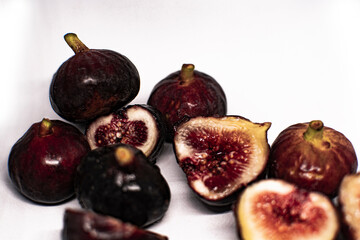 Healthy sandwiches with fresh figs and cream cheese, mint leaves, black plate, white background, empty space