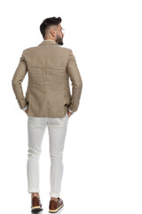 businessman looking to the side, holding his arms