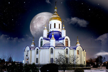 Night church in Ukraine against the background of the full moon and the starry sky - 493934480