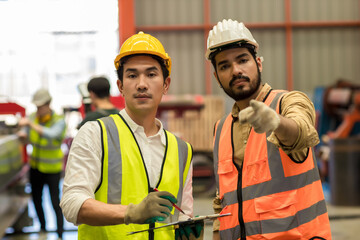 Foreman or worker work at factory site check up machine or products in site. Engineer or Technician checking Material or Machine on Plant.  Industrial and Factory.	