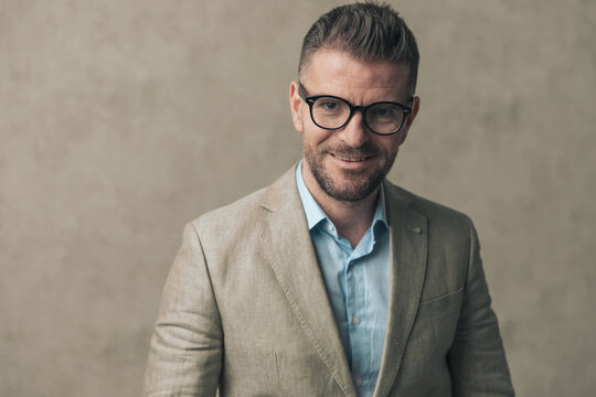 attractive businessman with cute smile is wearing eyeglasses