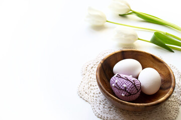 Fototapeta na wymiar Homemade crocheted Easter eggs. Easter holiday banner with copy space