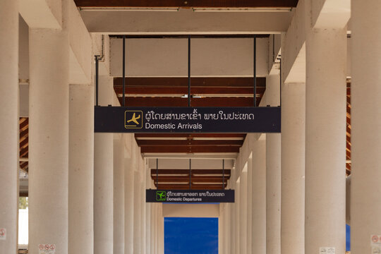 Vientiane, Laos - 18 Dec. 2019: Information signs for travellers in the domestic arrivals area of the Wattay International Airport Terminal