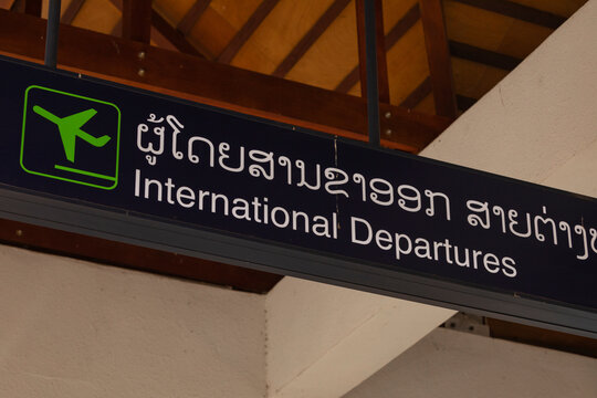 Vientiane, Laos - 18 Dec. 2019: Information signs for travelers in the departure area of international flights at Wattay International Airport Terminal