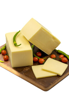 Cheddar cheese or kashkaval cheese isolated on white background. Cheese slices on the serving board