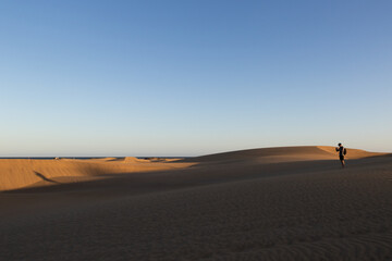 Fototapeta na wymiar walking on the sand dunes
