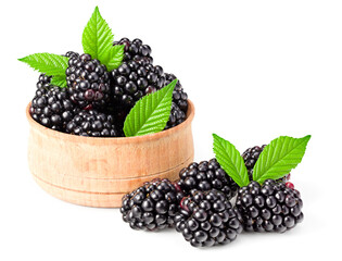 blackberries with leaves in wooden bowl isolated on white background. clipping path