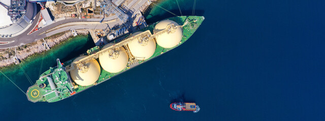 Aerial drone ultra wide panoramic photo with copy space of LNG (Liquified Natural Gas) tanker...