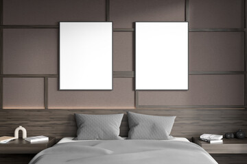 Dark bedroom interior with bed, two empty white posters