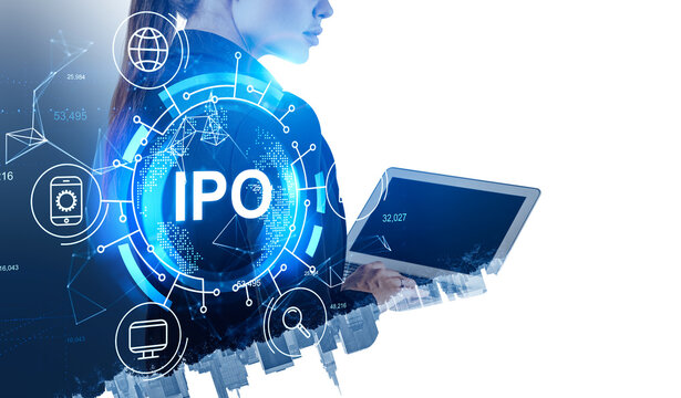 Businesswoman wearing suit is working on laptop at stock market