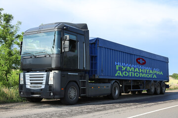 Fototapeta na wymiar Truck with humanitarian aid for Ukraine on road