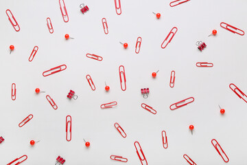 Composition with clips and pins on white background