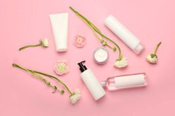 Composition with different cosmetic products and ranunculus flowers on pink background - Powered by Adobe