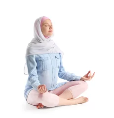 Fotobehang Pregnant Muslim woman meditating on white background © Pixel-Shot