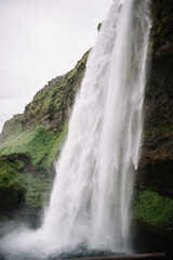 Seljalandsfoss stream of water dropping down into it's own pool. Iceland, waterfall