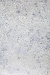 Empty light white concrete background. Rough old grainy stone texture