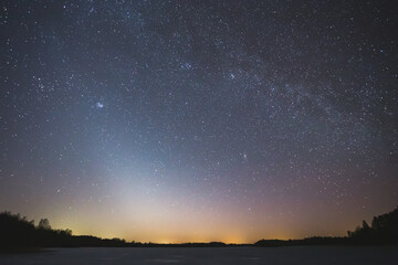 Fototapeta na wymiar Night landscape image with colorful milky way and zodiac light in the horizon